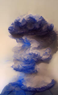 The artist Jasper Beck slowly dissolving into a cumulonimbus.